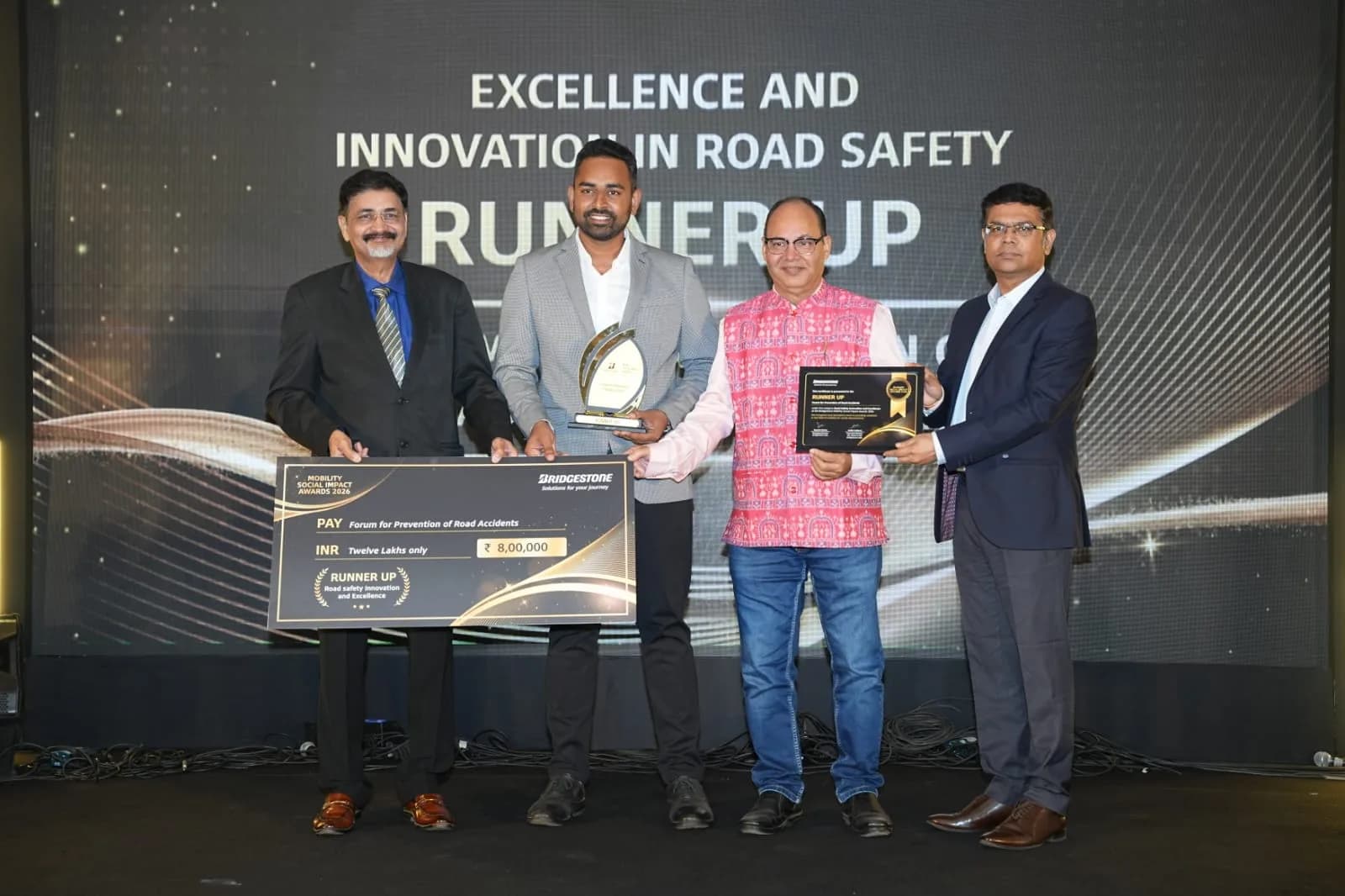 Receiving the Bridgestone Mobility Social Impact Awards 2026 at Pune,