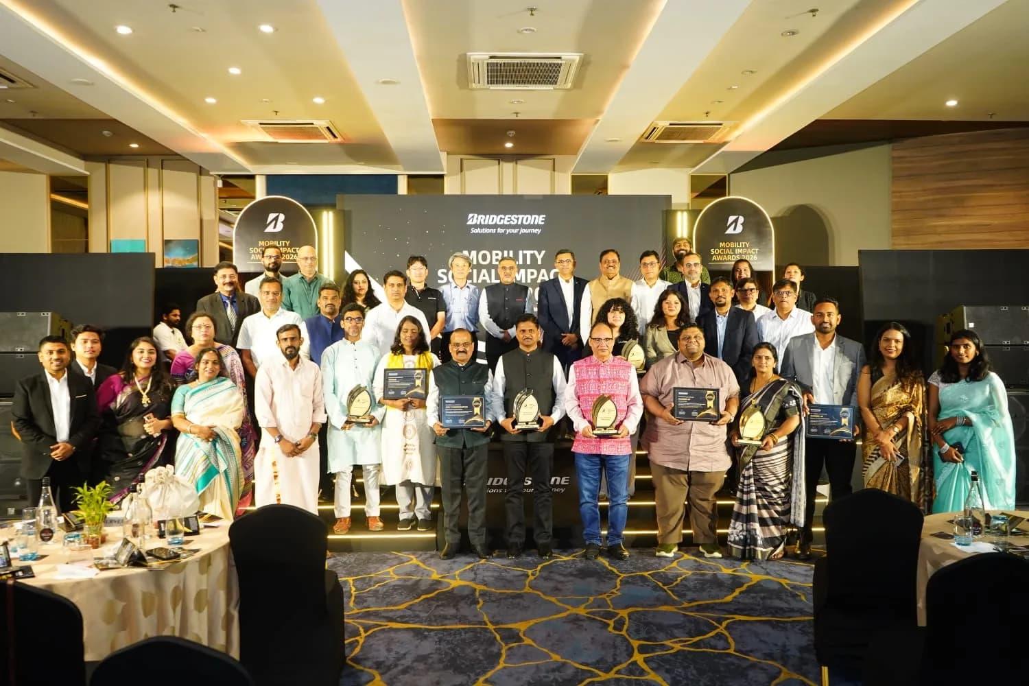 Receiving the Bridgestone Mobility Social Impact Awards 2026 at Pune,