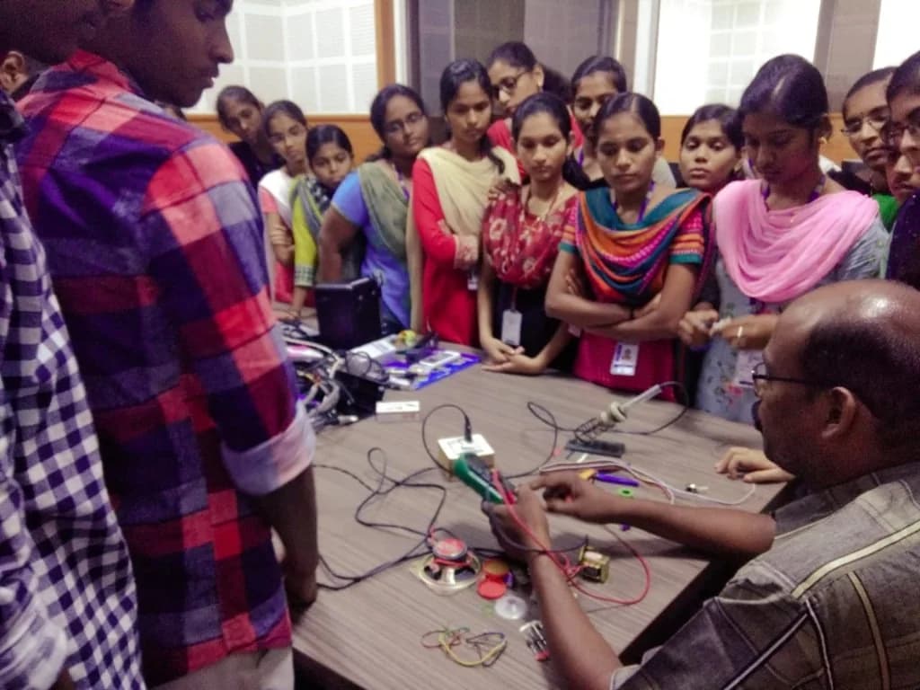 Hands-on electronics demonstration for students at a Bhannari FM workshop