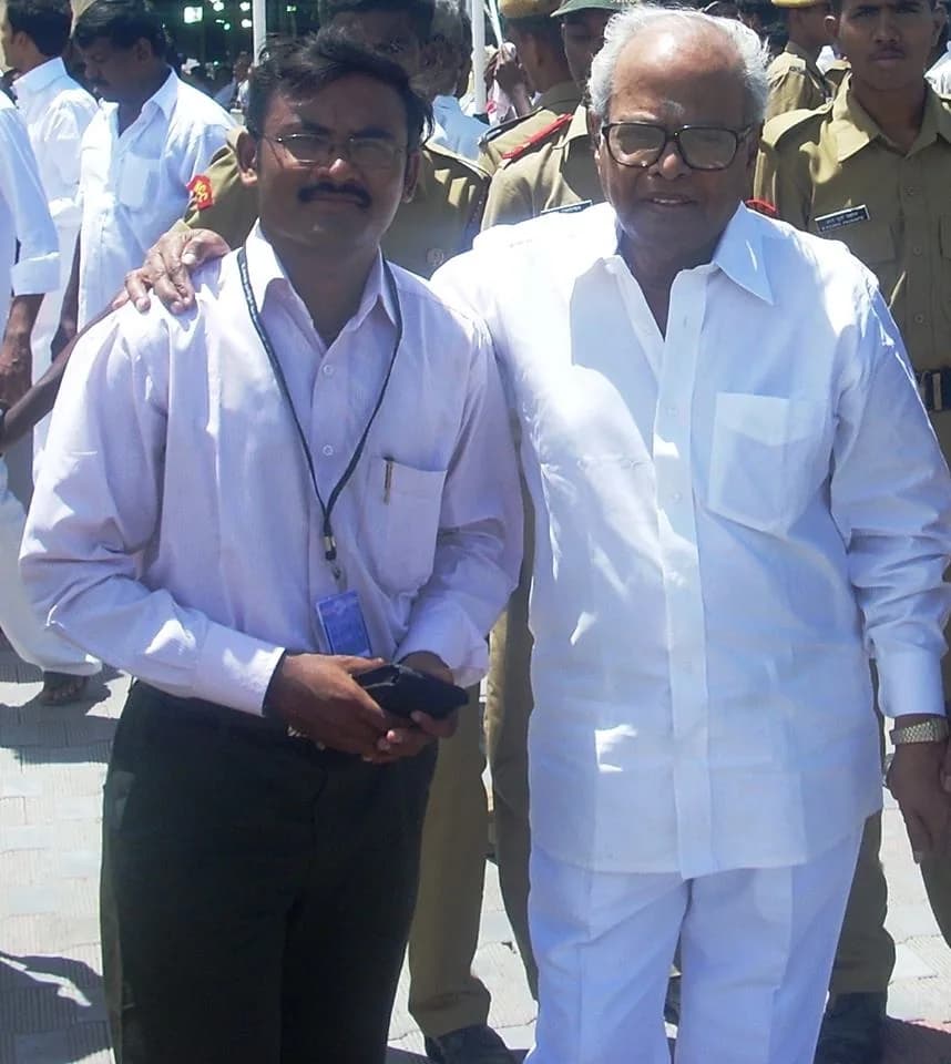 P. Vijayakumar with a VIP guest in white attire at an outdoor event