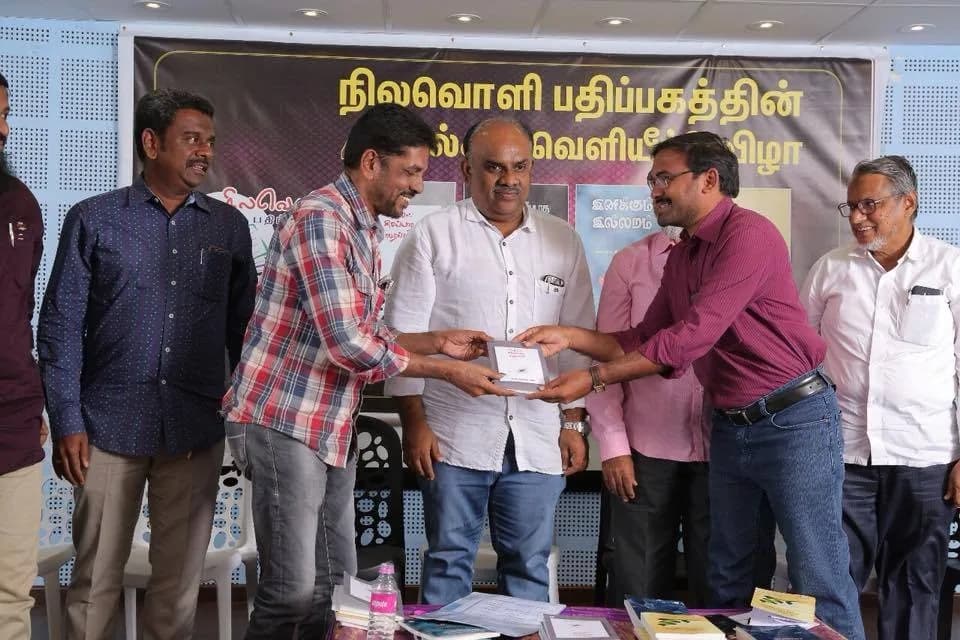 AirMedia team participating in a Nilavoli Publishing book release event