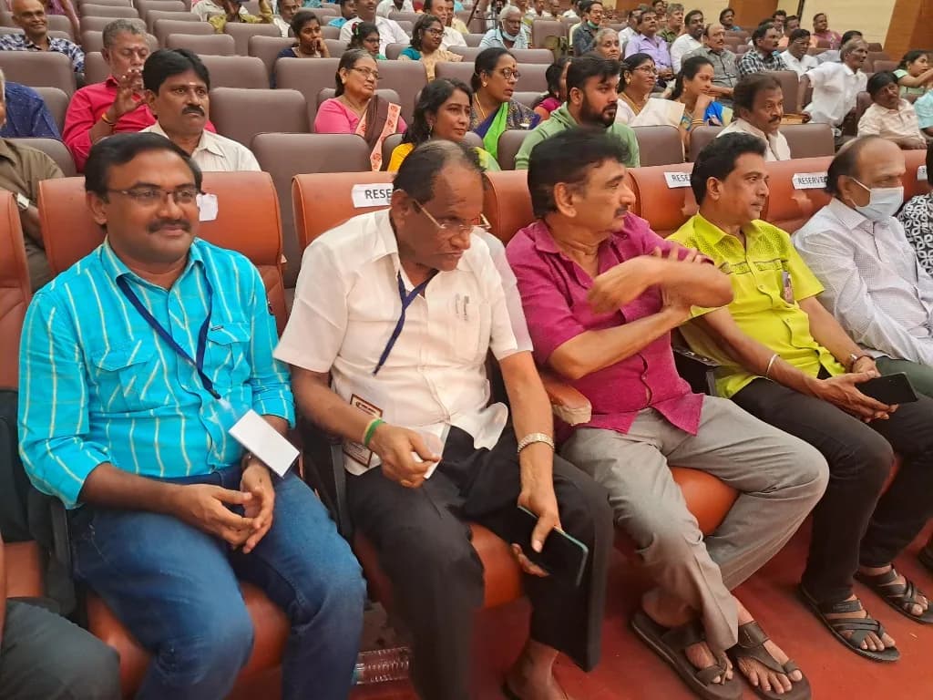 AirMedia team seated among VIP guests at a formal auditorium event