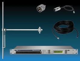 Compact FM transmitter with antenna, coaxial cable, and RF accessories